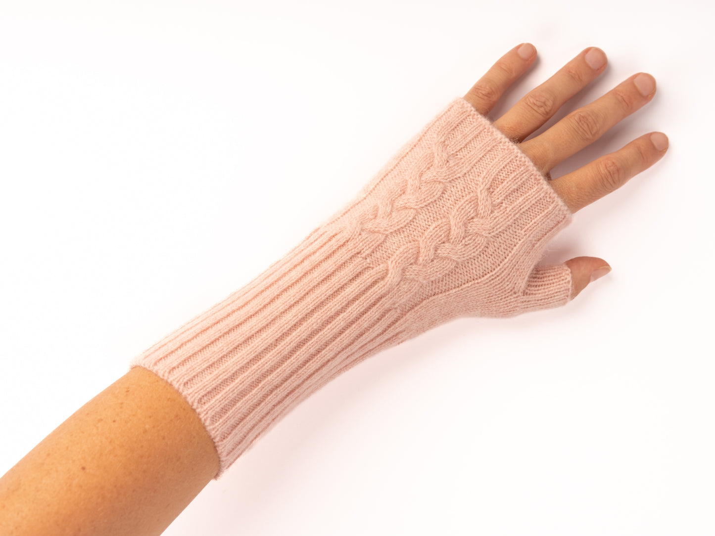 Pink cable knit mittens