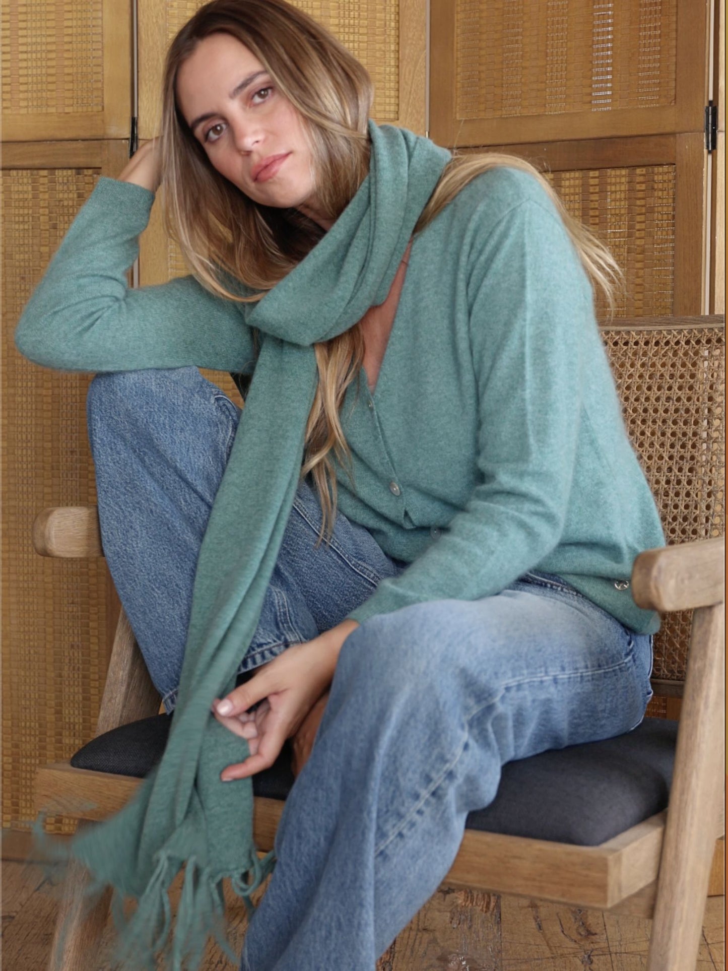 Green fringed knitted scarf